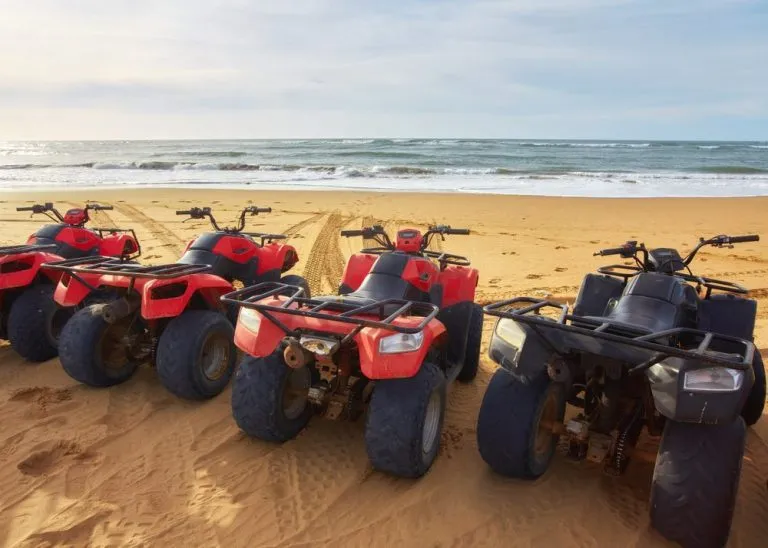 quad bikes beach sea